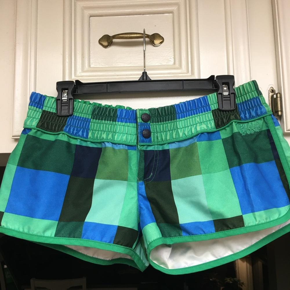 Billabong checkered board shorts. Snap front with elastic waist. Ladies size L.
